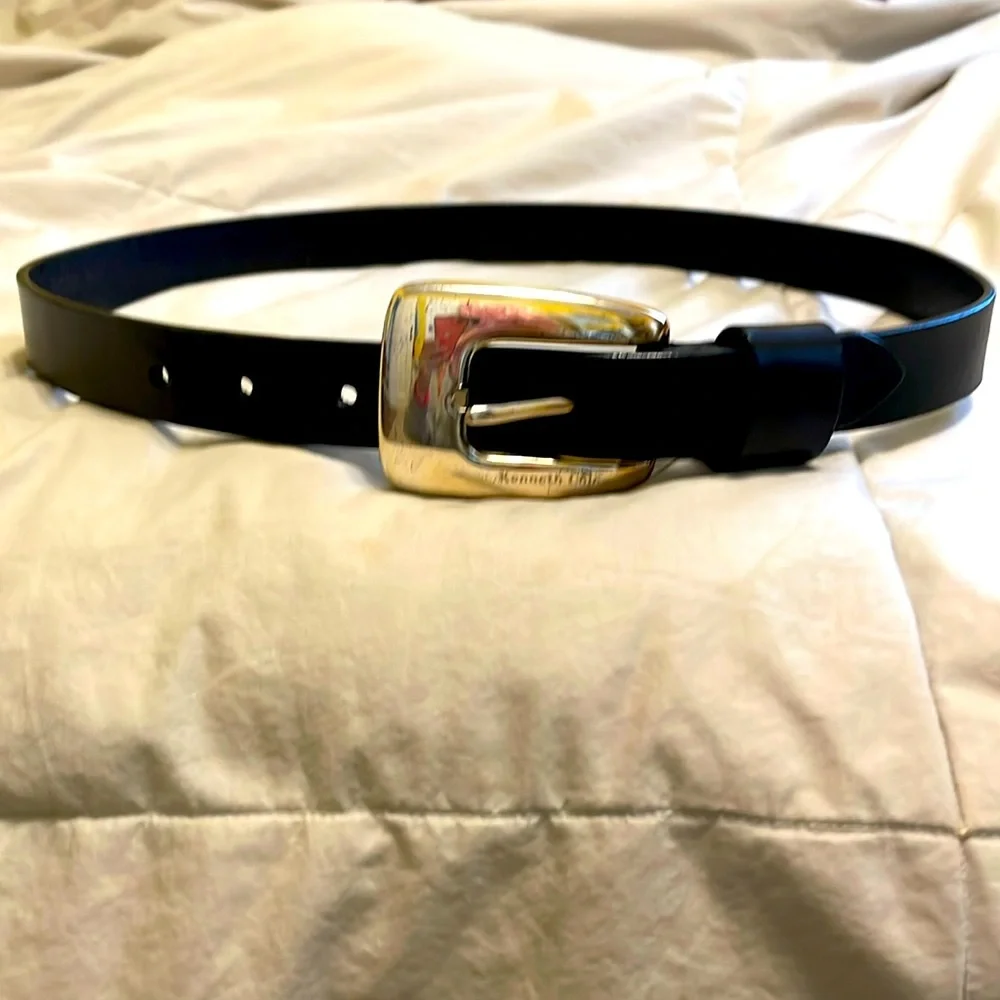 Genuine leather belt from Kenneth Cole. Metal buckle. Measures about 35 inches.